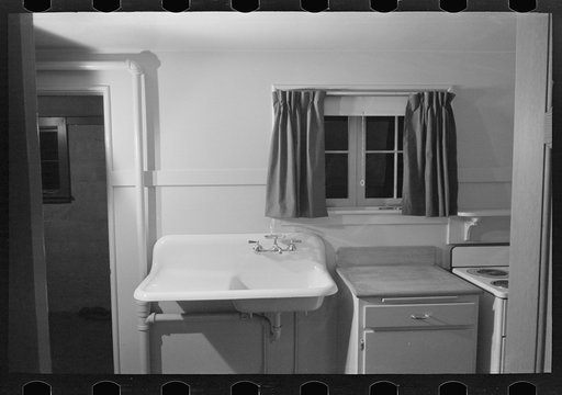 Untitled photo, possibly related to: Sink, refrigerator and stove in the kitchen of the model house at Greendale, Wisconsin