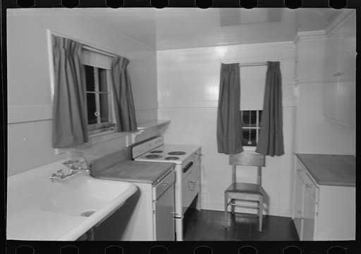 Untitled photo, possibly related to: Sink, refrigerator and stove in the kitchen of the model house at Greendale, Wisconsin