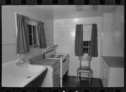 Untitled photo, possibly related to: Sink, refrigerator and stove in the kitchen of the model house at Greendale, Wisconsin