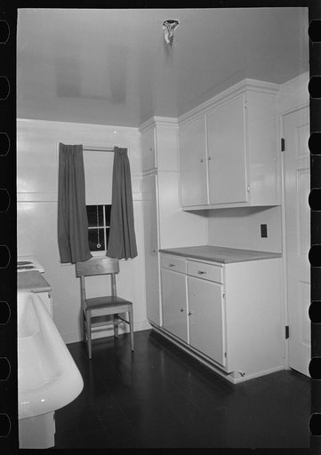 Untitled photo, possibly related to: Sink, refrigerator and stove in the kitchen of the model house at Greendale, Wisconsin