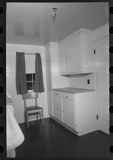 Untitled photo, possibly related to: Sink, refrigerator and stove in the kitchen of the model house at Greendale, Wisconsin
