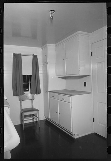 Untitled photo, possibly related to: Sink, refrigerator and stove in the kitchen of the model house at Greendale, Wisconsin