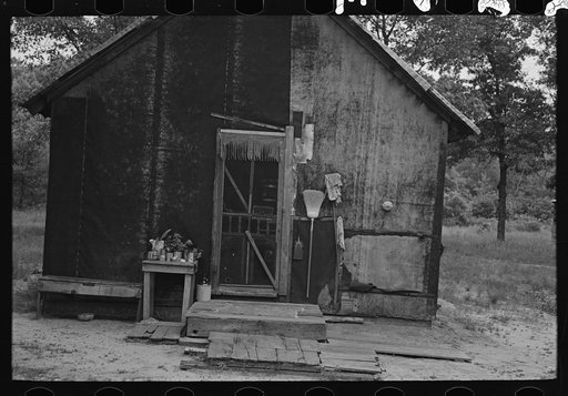 Backporch of Henry McPeak's house, Black River Falls, Wisconsin