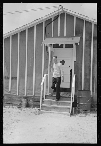 Untitled photo, possibly related to: Resettlement workers in front of camp building, Black River Falls Land Use Project, Wisconsin