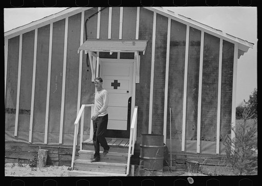 Untitled photo, possibly related to: Resettlement workers in front of camp building, Black River Falls Land Use Project, Wisconsin