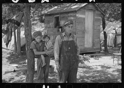 Alonzo Heath with two of his children. He is a farmer near Black River Falls, Wisconsin