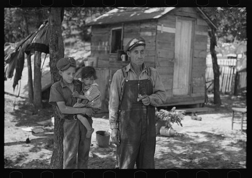 Untitled photo, possibly related to: Alonzo Heath with two of his children. He is a farmer near Black River Falls, Wisconsin