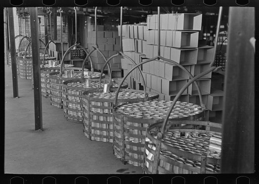 Racks full of canned peas on way to labeling room and warehouse, canning factory, Sun Prairie, Wisconsin