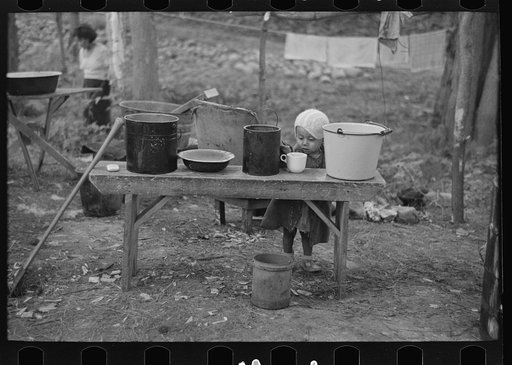 Indian child in blueberry pickers' camp near Little Fork, Minnesota