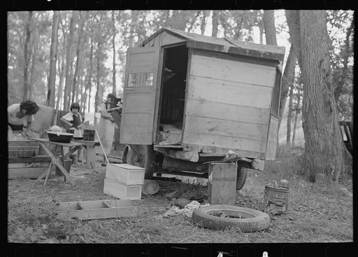 Untitled photo, possibly related to: Indian boy in front of tent near Little Fork, Minnesota