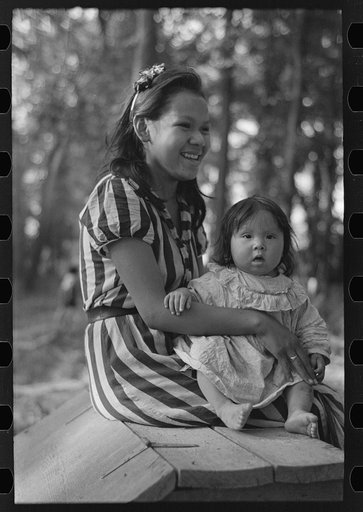 Young Indian mother and baby, blueberry camp, near Little Fork, Minnesota