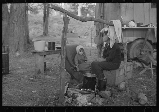 Indian mother and baby, blueberry pickers' camp near Little Fork, Minnesota