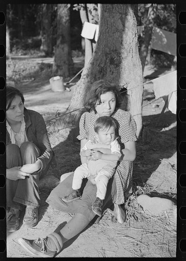 Indian girl and baby, blueberry pickers camp near Little Fork, Minnesota