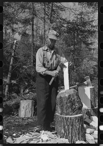 Using the broadaxe to make wedges, at camp near Effie, Minnesota