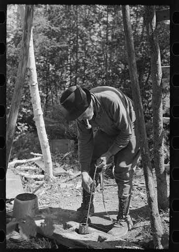 Untitled photo, possibly related to: Raising the iron pipe drill from the casing during drilling operations, near Winton, Minnesota