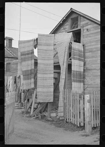 Rag rugs being aired, Winton, Minnesota