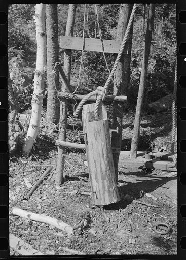 Untitled photo, possibly related to: William Besson working on his drilling rig on location, near Winton, Minnesota