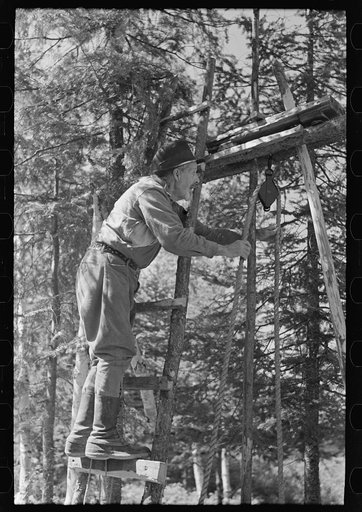 William Besson working on his drilling rig on location, near Winton, Minnesota