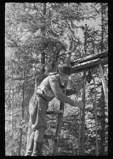 Untitled photo, possibly related to: William Besson working on his drilling rig on location, near Winton, Minnesota