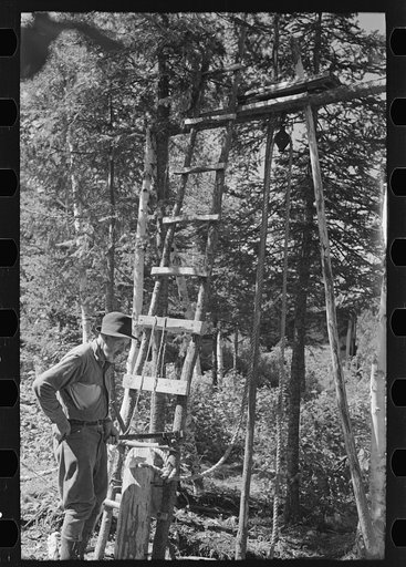 William Besson and his drilling rig. Near Winton, Minnesota
