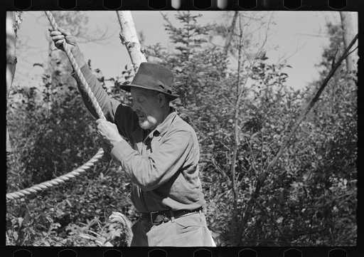 William Besson, old mining prospector, at work near Winton, Minnesota