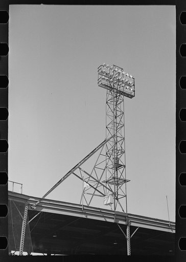 Untitled photo, possibly related to: Signs and lighting standards at baseball park, Saint Paul, Minnesota