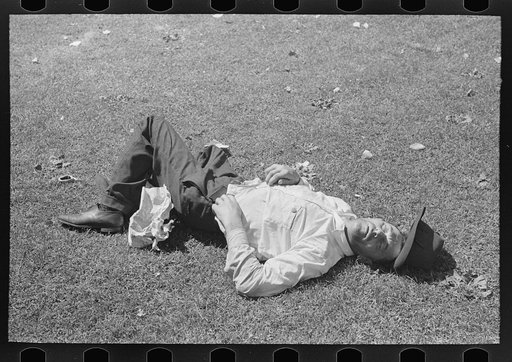 Transient laborer asleep in park, Gateway District, Minneapolis, Minnesota