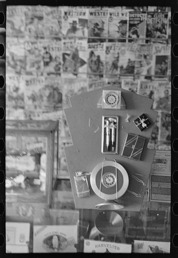 Untitled photo, possibly related to: Drugstore display of magazines, Cook, Minnesota