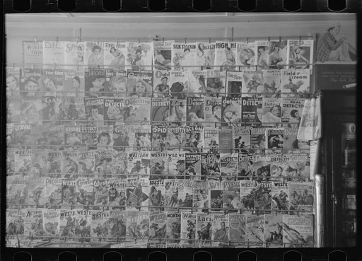 Untitled photo, possibly related to: Drugstore display of magazines, Cook, Minnesota
