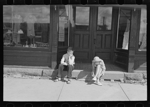 Untitled photo, possibly related to: Girl reading newspaper in restaurant bar, Tower, Minnesota