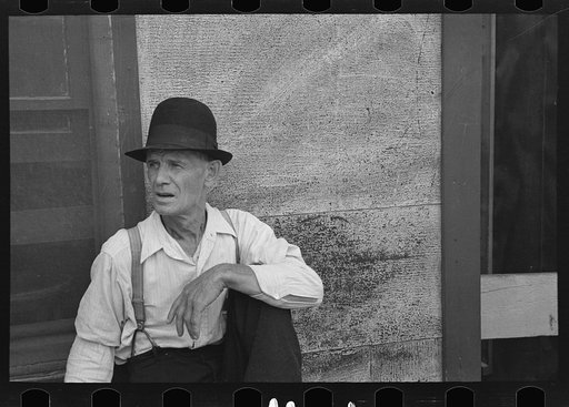Untitled photo, possibly related to: Man sitting on bench, Craigville, Minnesota