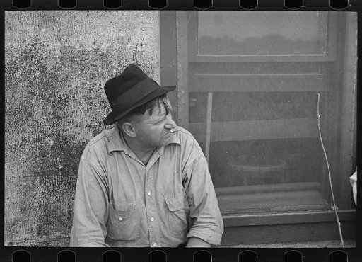 Man in front of store, Craigville, Minnesota