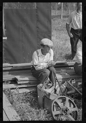 Man at auction sale, Sparlin farm, Orth, Minnesota