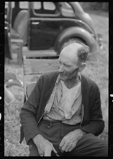 An old farmer at Sparlin's auction sale, Orth, Minnesota