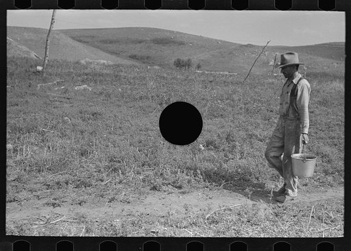 Untitled photo, possibly related to: William Huravitch and son, carrying water to their home; the source is about a half mile away. Williams County, North Dakota