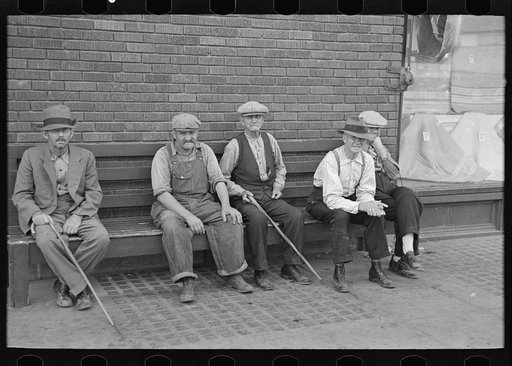 Men sitting on bench, Williston, North Dakota