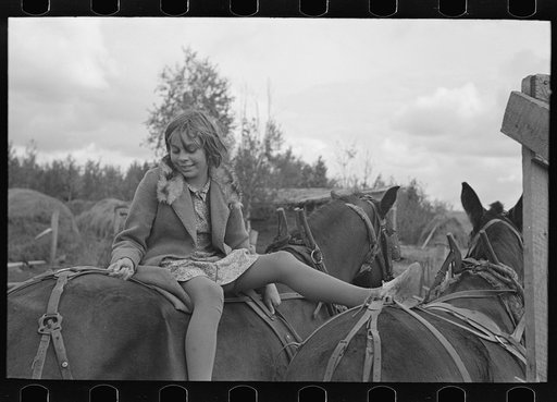 Girl astride mule, farm near Northome, Minnesota