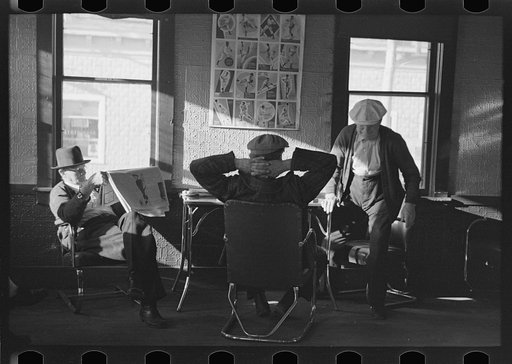 Lumberjacks in hotel lobby at Durman Hotel, Little Forks, Minnesota. Many of the men that rise early spend a few hours here reading and talking before going to work