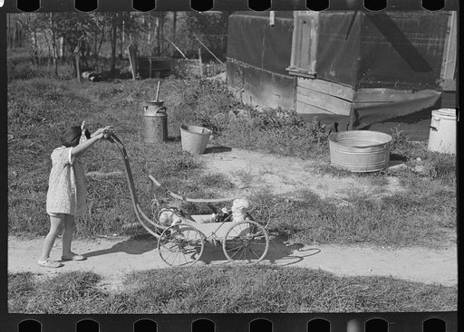 Untitled photo, possibly related to: Doll buggy on farm near Northome, Minnesota