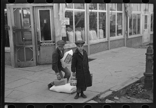 Farm children with supplies on street corner, Northome, Minnesota