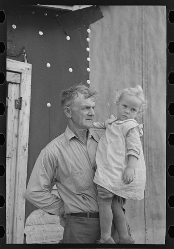 Cut-over farmer and daughter, near Northome, Minnesota