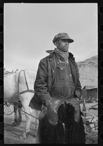 Farmer in chaps, Sheridan County, Montana