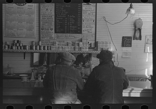 Two men eating breakfast in cafe, Granville, North Dakota