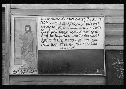 Sign on outside of church, pine area, New Jersey