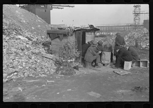 Unemployed workers in front of a shack with Christmas tree, East 12th Street, New York City