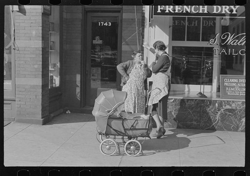 Women with baby carriage, L Street, Washington, D.C.
