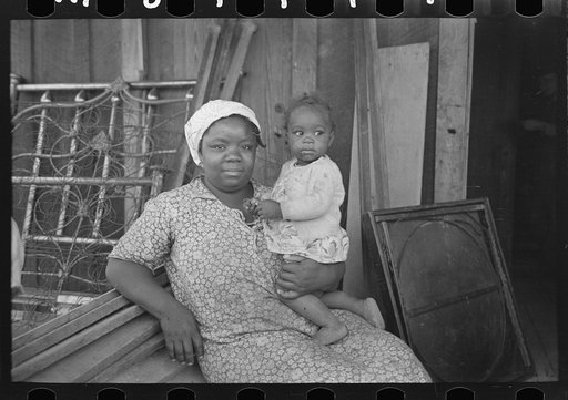 Untitled photo, possibly related to: Mother and child, FSA (Farm Security Administration) clients, former sharecroppers, just before moving to Southeast Missouri Farms