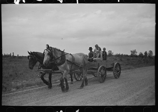 Untitled photo, possibly related to: Southeast Missouri Farms. FSA (Farm Security Administration) client sitting on load of groceries in trailer