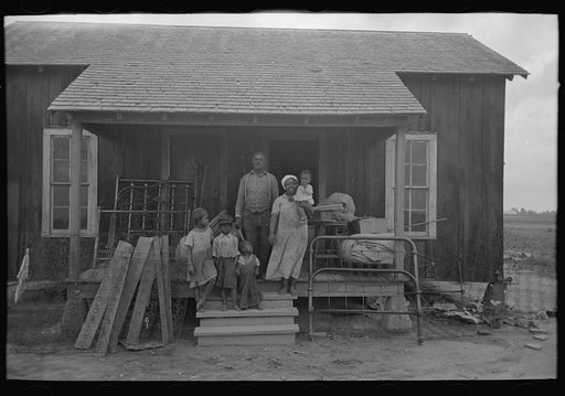 Untitled photo, possibly related to: Mother and child, FSA (Farm Security Administration) clients, former sharecroppers, just before moving to Southeast Missouri Farms