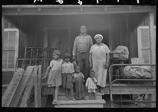 Untitled photo, possibly related to: Mother and child, FSA (Farm Security Administration) clients, former sharecroppers, just before moving to Southeast Missouri Farms
